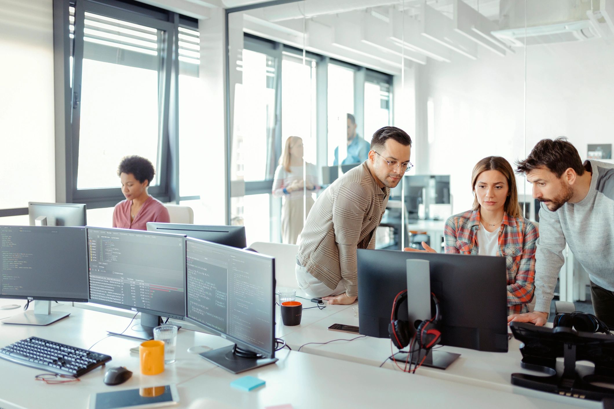Software development team collaborating in an office